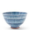 A ceramic bowl with a blue and white striped ribbed pattern and a small reddish-brown base, shown on a clean white background.