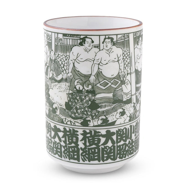 A white ceramic sake cup featuring a detailed green and black illustration of sumo wrestlers, with bold green kanji characters printed along the bottom, set against a plain white background.