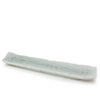 A long, narrow rectangular ceramic dish or tray with a pale celadon green glaze, shown on a plain white background.