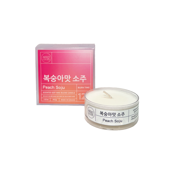 Peach Soju tealight candle beside box