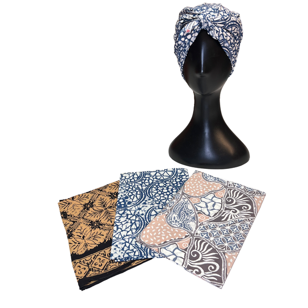 Mannequin head with patterned headscarf and three fabric swatches on a white background