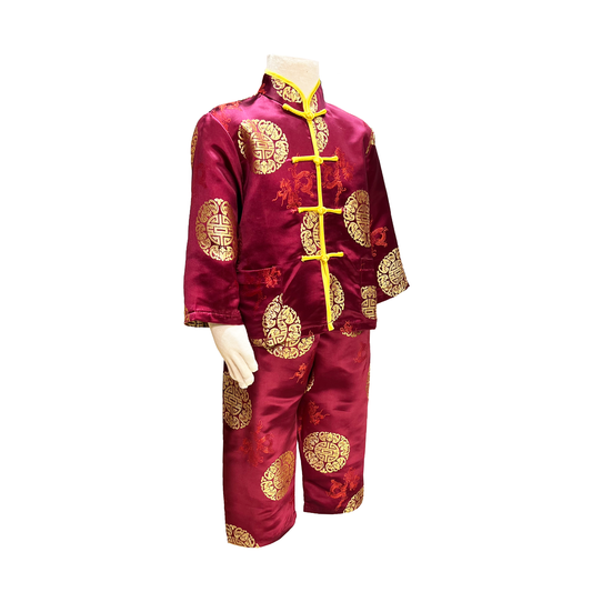 Traditional kids outfit in burgundy with gold medallion design on mannequin