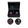 Set of two blue balls with butterfly designs in a black box on a white background