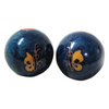 Two blue marbled balls with butterfly designs on a white background