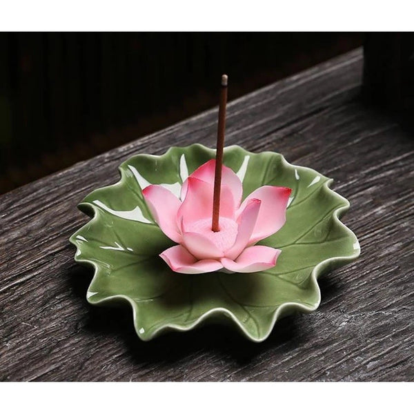 Ceramic Pink Lotus Incense Burner with Green Dish. Single piece of incense is in the pink lotus incense burner.