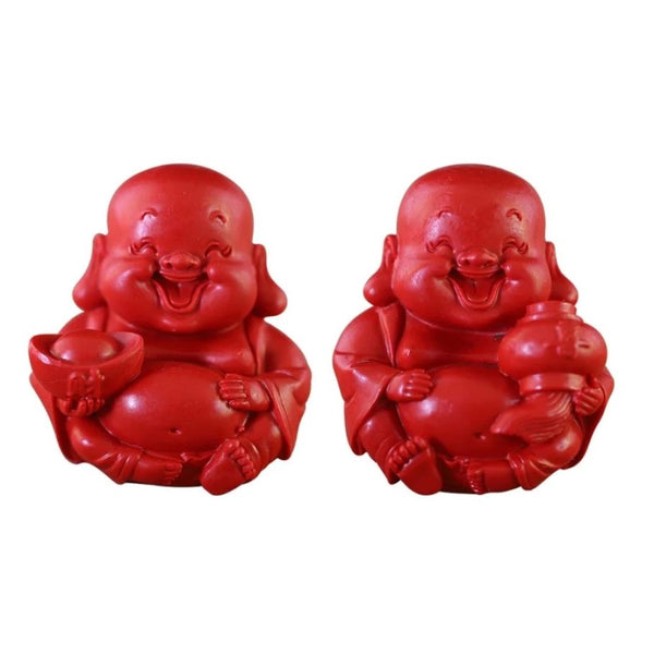 2 Red Joyful Buddhas. Buddha on the left is holding an ingot and buddha on the right is holding a lantern with a tassel.