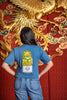 The back of the Jing Fong T-Shirt - Steel Blue. There is a large, yellow Fu Dog serving dim sum.
