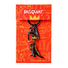 Keychain with a dinosaur design on a red background with 'Basquiat' branding.