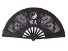 Black fan with white dragons and yin yang symbol