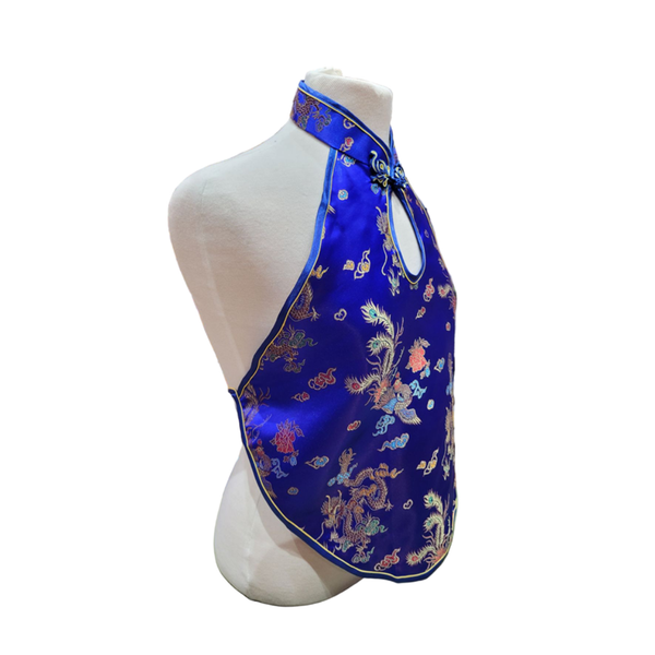 Blue embroidered halter top on a mannequin against a white background