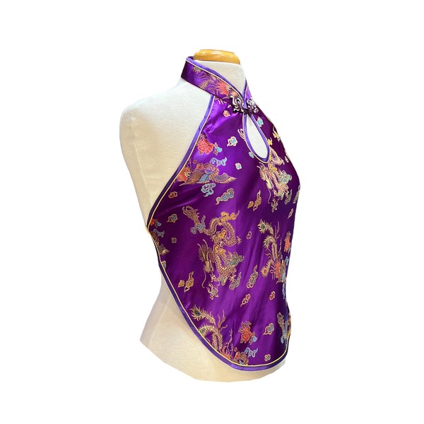Purple satin halter top with dragon design on a mannequin against a white background