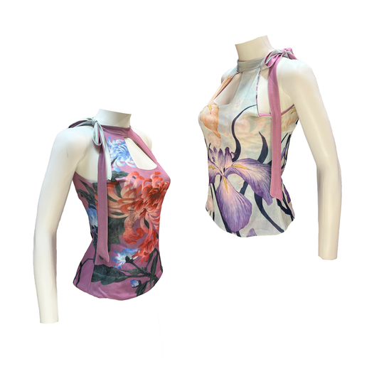 Two sleeveless tops with floral designs on mannequins against a white background