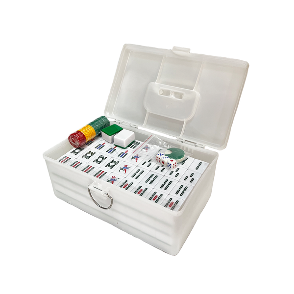White mahjong set with tiles and dice in a clear plastic box on a white background