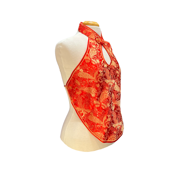 Red floral halter top on a mannequin against a white background