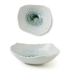 Two light blue ceramic bowls on a white background