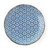 Round plate with blue and white geometric pattern on a white background