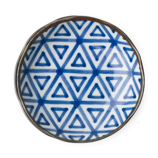 Round ceramic plate with blue triangle pattern on a white background