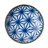 Ceramic plate with blue geometric pattern on a white background
