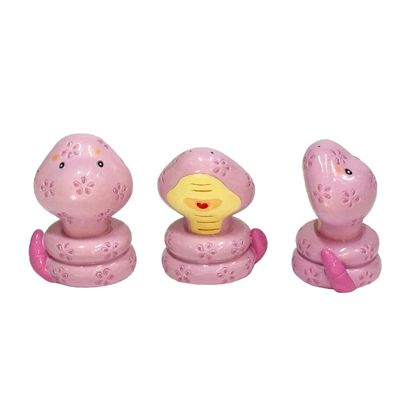 Cute purple snake figurine from different angles