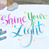 Sample calligraphy drawing using Sakura Gelly Roll Stardust Meteor to highlight the glitter property of the pens.