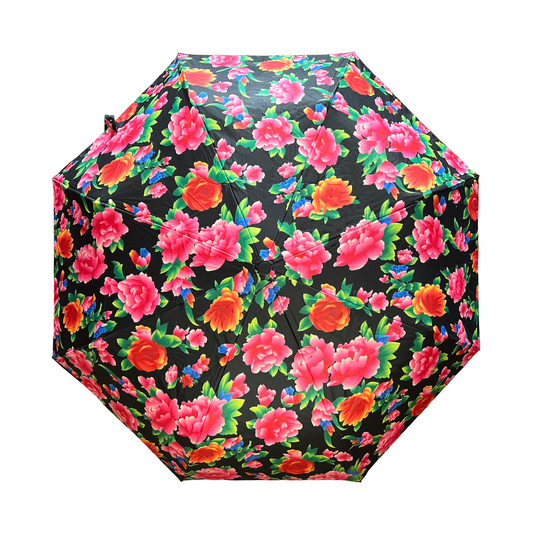 Floral-patterned umbrella with pink, red, and green flowers on a black background
