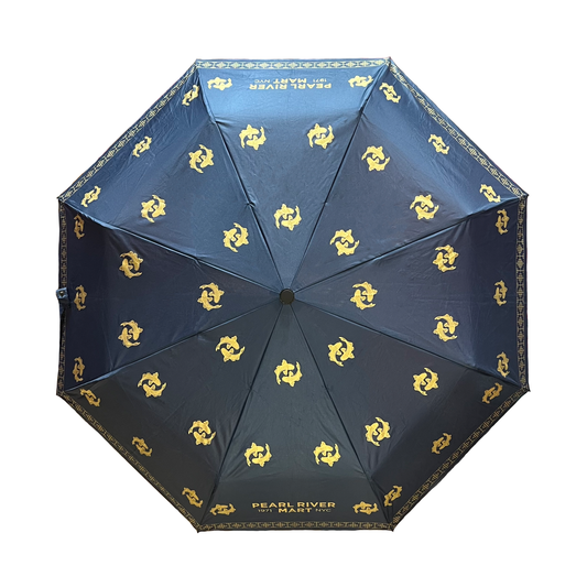 Navy blue umbrella with yellow double fish patterns on a white background