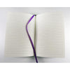 Open notebook with a purple ribbon on a white background