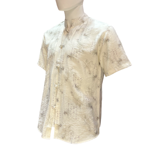 Beige patterned shirt on a mannequin against a white background