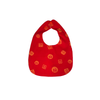 Red bib with orange patterns on a white background