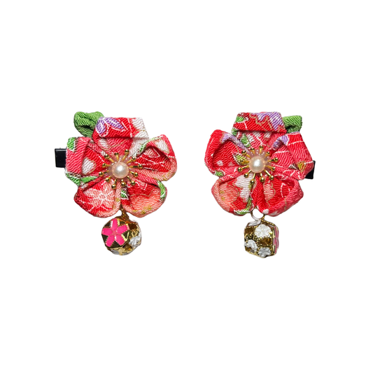 Colorful floral hair clips with decorative elements on a white background