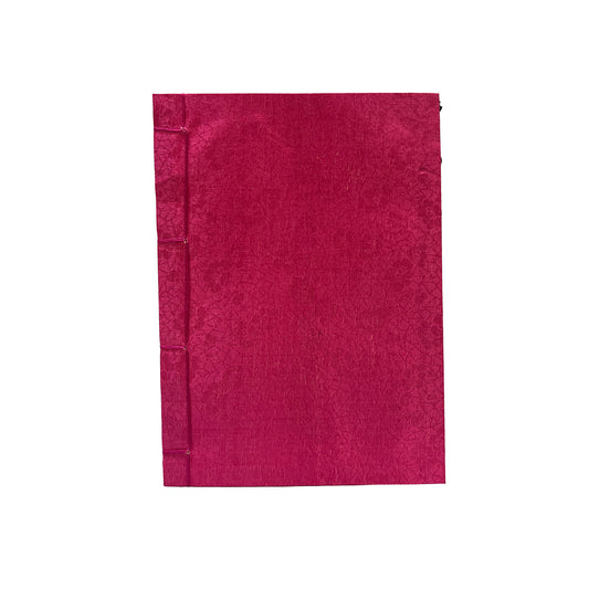 Red notebook on a white background