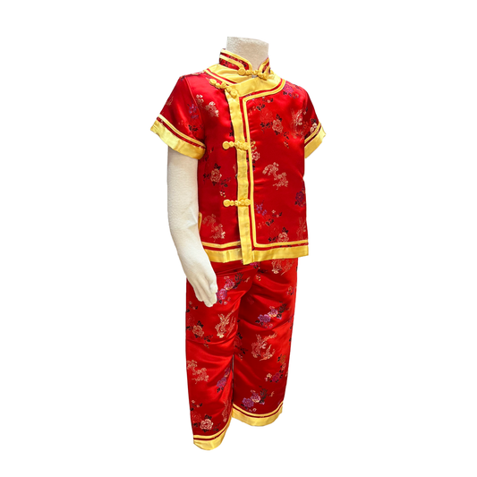 Traditional kids outfit in red with gold trim and floral pattern on mannequin