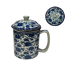 Ceramic mug with blue floral pattern and matching lid on a white background