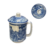 Ceramic mug with lid featuring blue and white design on a white background