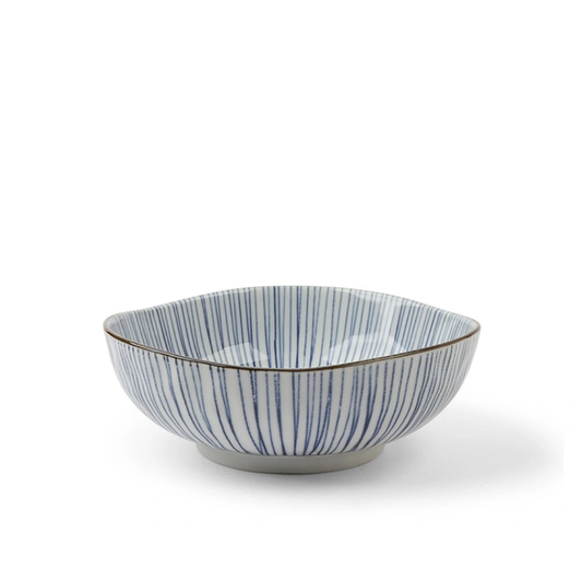 Decorative bowl with blue and white striped pattern on a white background