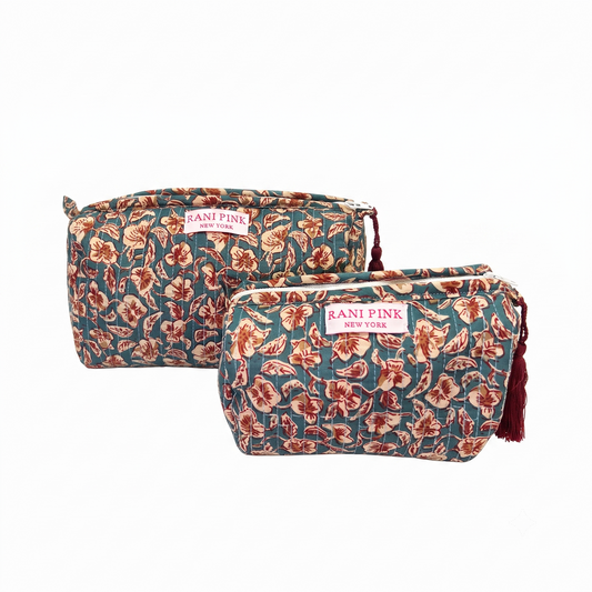 Two teal bags with burgundy flowers and Rani Pink label