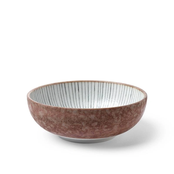 Brown ceramic bowl with a white interior on a white background