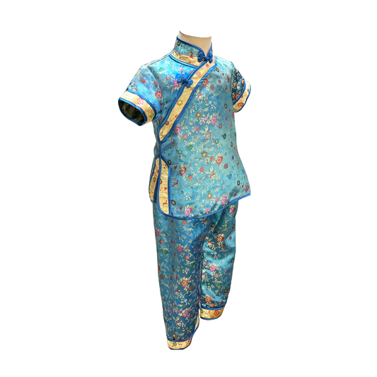 Traditional kids outfit in turquoise with gold trim and multicolor flowers on mannequin