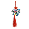 Decorative horse ornament with red tassel on a white background