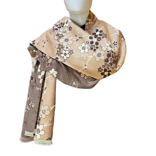 Floral patterned scarf on a mannequin against a white background