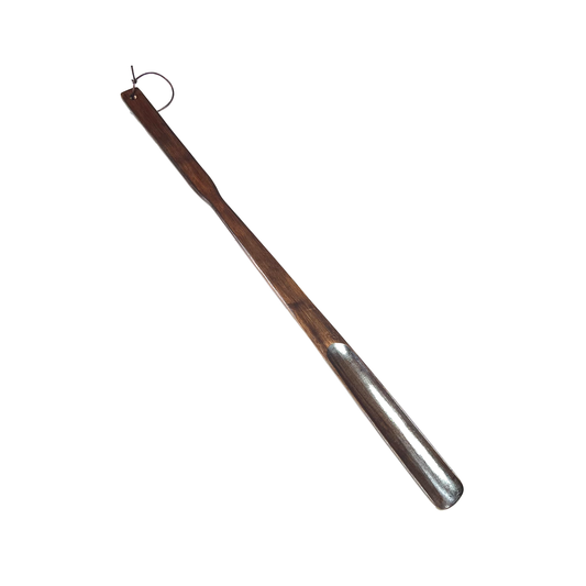 Dark wood shoehorn on white background