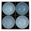 A set of four ceramic bowls, each with a distinct blue and white pattern: geometric stars, checkerboard, vertical stripes, and small diamonds, all arranged in a black box.
