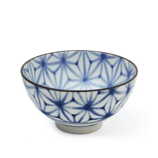 Ceramic bowl with blue and white pattern on a white background
