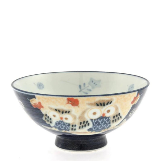A ceramic rice bowl with a design of perched owls, predominantly in blue and beige colors.