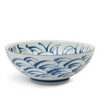 Ceramic bowl with blue wave design on a white background