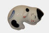 Ceramic cat-shaped object with blue, white, and black colors on a white background.