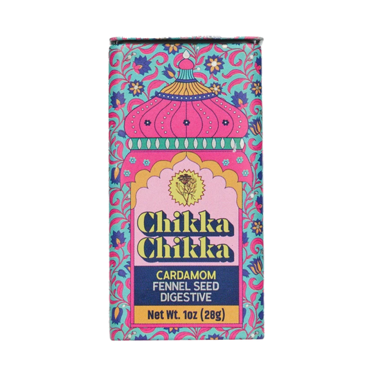 A rectangular box of Chikka Chikka Cardamom Fennel Seed Digestive, featuring a vibrant pink and turquoise patterned design with a central pink arch and yellow text.