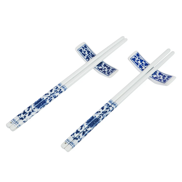 2 sets of blue on white floral design chopsticks with blue floral rests