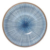 A round ceramic plate with a blue and white radial dotted pattern and a brown rim, shown from a top-down view on a white background.