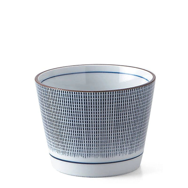 Ceramic mug with grid pattern on a white background